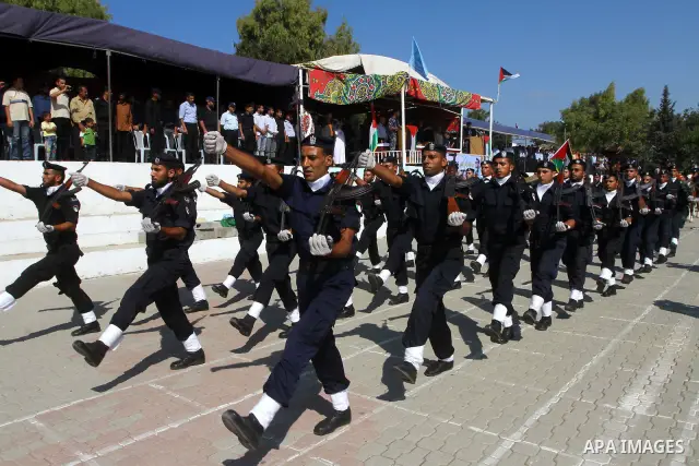 Hamas police officers demonstrate their skills during a ceremony in Gaza City in front of the media and Palestinian prisoners released in a recent swap between Hamas and Israel October 27, 2011. The Egyptian-brokered swa...