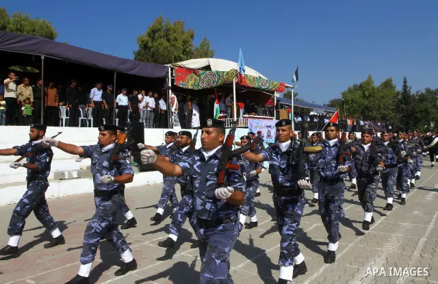 Hamas police officers demonstrate their skills during a ceremony in Gaza City in front of the media and Palestinian prisoners released in a recent swap between Hamas and Israel October 27, 2011. The Egyptian-brokered swa...