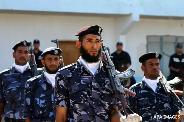 Hamas police officers demonstrate their skills during a ceremony in Gaza City in front of the media and Palestinian prisoners released in a recent swap between Hamas and Israel October 27, 2011. The Egyptian-brokered swa...
