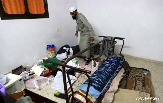 Palestinians inspect a damage room of their home in the Balata Refugee Camp in the West Bank City of Nablus, on 27 October 2011. Homes at the camp were apparently damaged during an Israeli military raid on a manhunt for...
