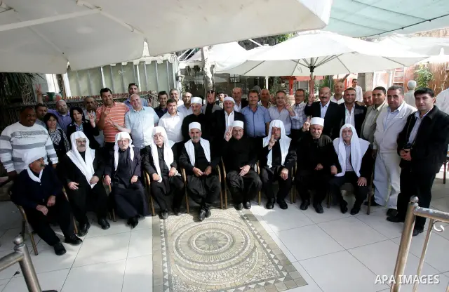 Members of the occupied Golan heights delegation visits the tent outside the Red Cross headquarters in east Jerusalem on October 28, 2011 in solidarity with Hamas legislators who took refugee inside the ICRC building in...