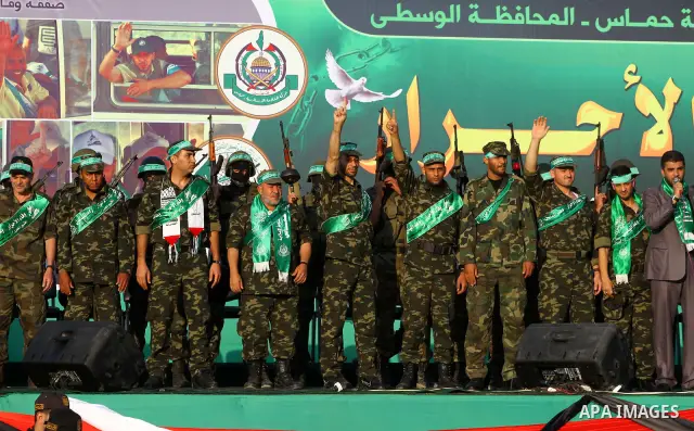 Freed Palestinian prisoners attend a celebration of the recent release of hundreds of Palestinians by Israel in the central Gaza Strip, Friday, Oct. 28, 2011. Hundreds of Palestinians were released in exchange for captur...