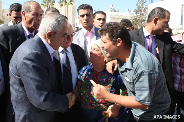 Palestinian Prime Minister Salam Fayyad attends the opening Festival of the olive harvest eleventh century in Bethlehem on Oct. 29, 2011. Photo by Mustafa Abu Dayeh