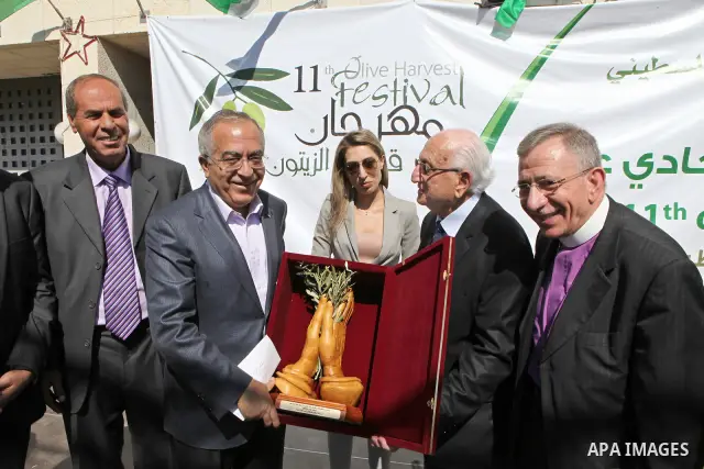 Palestinian Prime Minister Salam Fayyad attends the opening Festival of the olive harvest eleventh century in Bethlehem on Oct. 29, 2011. Photo by Mustafa Abu Dayeh