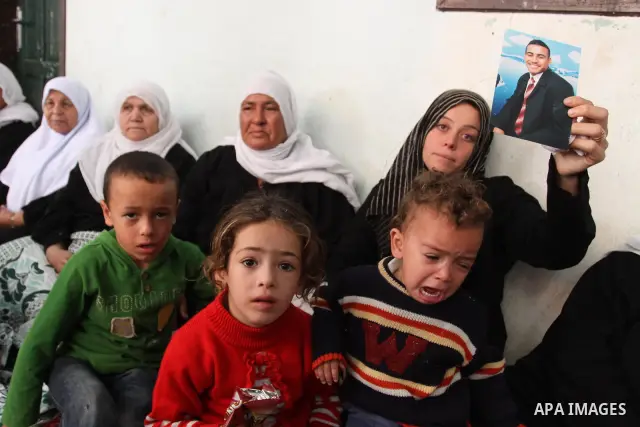 Relatives of Palestinian Islamic Jihad militant during his funeral in Gaza City on Oct. 30, 2011, killed during Israeli air raids late last night. The Islamic Jihad said it would observe an Egyptian-brokered truce in and...