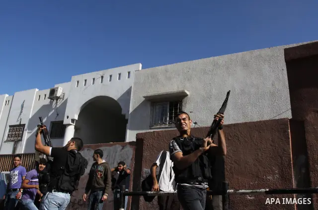 Palestinian mourners shout slogans during the funerals of militants of the Islamic Jihad movement in Gaza City on Oct. 30, 2011, killed during Israeli air raids late last night. The Islamic Jihad said it would observe an...