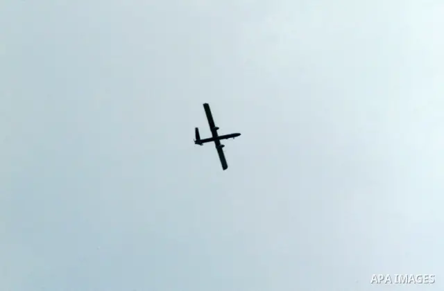 An Israeli drone is seen over Rafah town in the southern Gaza Strip on Oct. 30, 2011. An Egyptian-brokered truce failed to take hold on Sunday to halt violence between Israel and Gaza militants in which nine Palestinian...