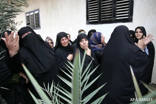 Palestinian women react during the funeral of DFLP militant Ahmed Jargon, killed in an Israeli strike on Sunday, in Rafah, southern Gaza Strip, Monday, Oct. 31, 2011. Deadly violence between Israel and Gaza militants fla...