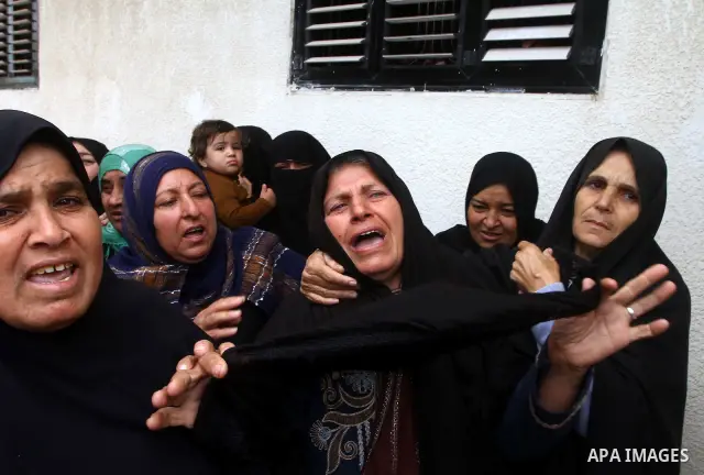 Palestinian women react during the funeral of DFLP militant Ahmed Jargon, killed in an Israeli strike on Sunday, in Rafah, southern Gaza Strip, Monday, Oct. 31, 2011. Deadly violence between Israel and Gaza militants fla...