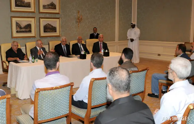 Palestinian President Mahmoud Abbas meets with the freed Palestinian prisoners who released to Qatar in Doha October 31, 2011. Photo by Thaer Ganaim