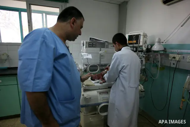 A newborn baby receives treatment in the maternity ward of Al-Shefa hospital in Gaza city Nov. 02, 2011. The world's population will reach seven billion on Oct. 31, according to projections by the United Nations, which s...