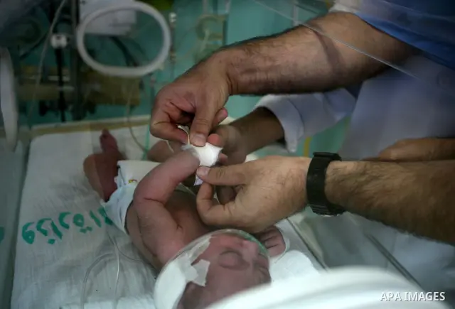A newborn baby receives treatment in the maternity ward of Al-Shefa hospital in Gaza city Nov. 02, 2011. The world's population will reach seven billion on Oct. 31, according to projections by the United Nations, which s...