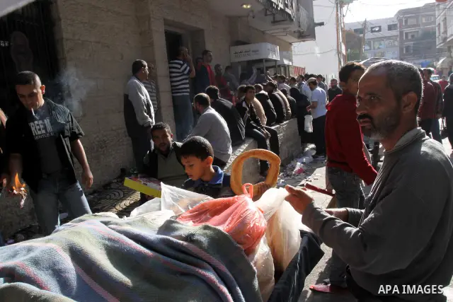 A Palestinian Displays of Goods in front of Arab Bank in Gaza city ,Palestinian Authority civil servants gather outside the Arab Bank in Gaza city on Nov. 03,2011. Photo by Mohammed Asad