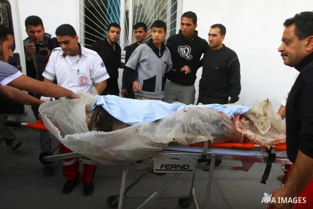 Palestinians mourn the bodies of two militants killed by Israeli troops, in the northern Gaza Strip November 3, 2011. Israeli forces killed the two Palestinian militants in a clash along the Israel-Gaza border on Thursda...