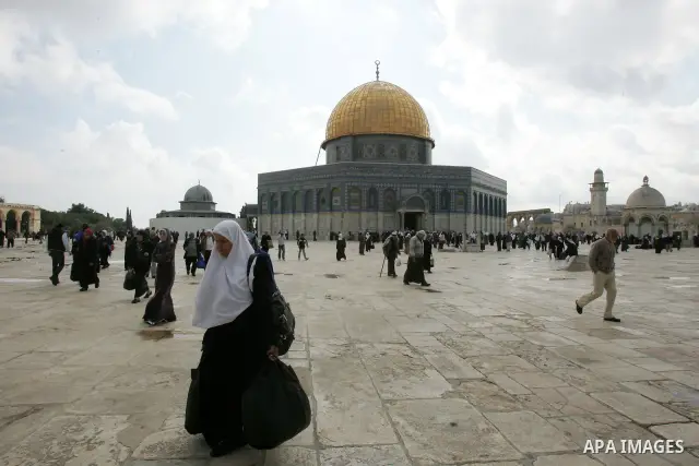 Palestinians walk in front of the Dome of the Rock after Friday prayers at Al-Aqsa mosque compound in Jerusalem's old city on Nov. 4,2011, ahead of the Muslim Eid al-Adha festival at the end of the week. Muslims across t...