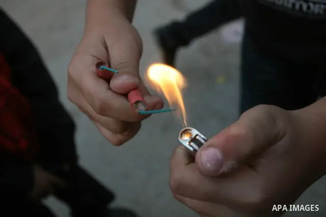 A Palestinians boys play with a toy gun in the West Bank city of Ramallah Nov.06, 2011. Muslims worldwide celebrate Eid al-Adha, or the Feast of the Sacrifice, by sacrificial killings of livestock to commemorate a religi...