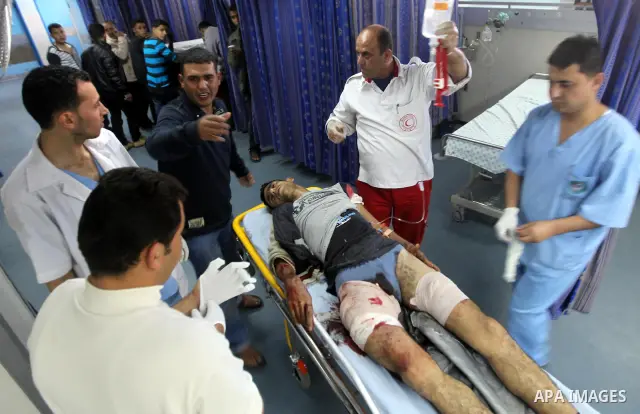 A Palestinian youth Transfering wounded at al Shifa hospital following an Israeli airstrike in Gaza City on Nov. 07, 2011. Muslims worldwide celebrate Eid al-Adha, or the Feast of the Sacrifice, by sacrificial killings o...