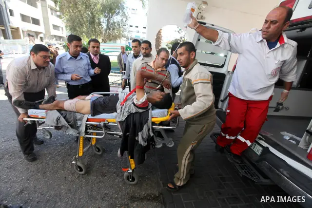 A Palestinian youth Transfering wounded at al Shifa hospital following an Israeli airstrike in Gaza City on Nov. 07, 2011. Muslims worldwide celebrate Eid al-Adha, or the Feast of the Sacrifice, by sacrificial killings o...