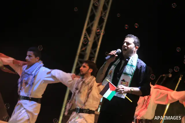 A religious eulogy band perform during islamic celebration of the upcoming Eid al-Adha fetival in Khan Younis, southern Gaza Strip on November 8, 2011. Photo by Majdi Fathi