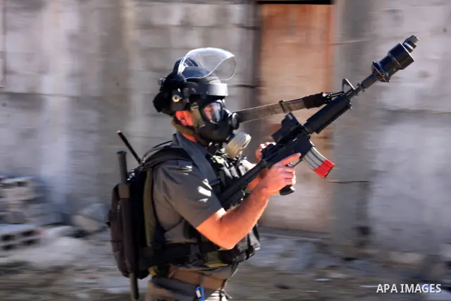 Israeli forces clash with Palestinian protestors during a weekly demonstration against Israeli-occupation in the northern West Bank village of Kfar Kadum, on November 11, 2011. The Palestinian leadership is unsure how to...