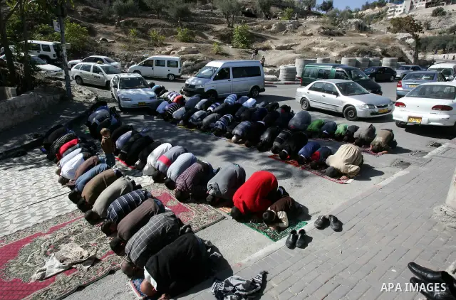 Palestinians attend Friday prayers at the protest tent in the Silwan neighborhood in East Jerusalem on Nov. 11,2011 as Palestinian protesters gather for a demonstration. Photo by Mahfouz Abu Turk