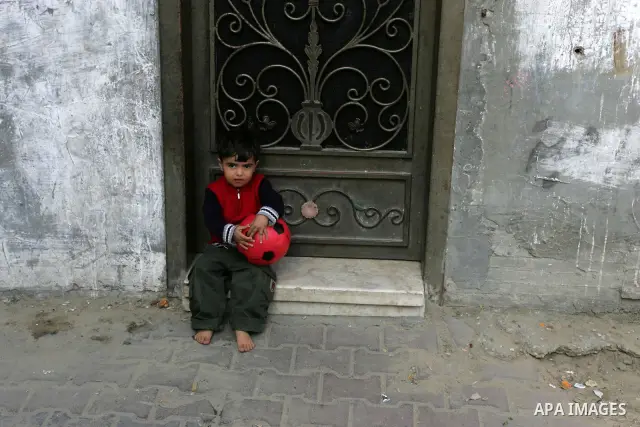 Palestinian children play outside their house in Rafah refugee camp in the southern Gaza Strip on Nov. 12, 2011. According to a member of the Executive Committee of the Palestine Liberation Organisation Saeb Erekat, ther...