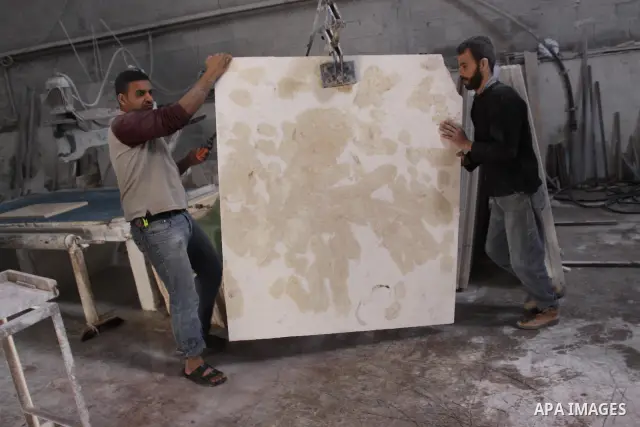 Palestinian worker prepare marble in a factory for marbles in Gaza city on Nov. 13, 2010. Palestinian suffer from decreasing in the industrial materials because of the israeli blockade on Gaza Strip. Photo by Mohammed As...