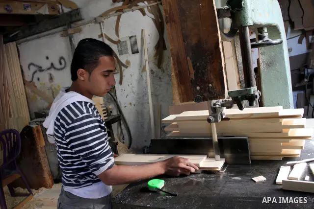 A Palestinian carpenter works at his shop in Gaza city on Nov. 14, 2011. Israel allow the Palestinians to export of furniture to Israel and Europe. Photo by Mohammed Asad