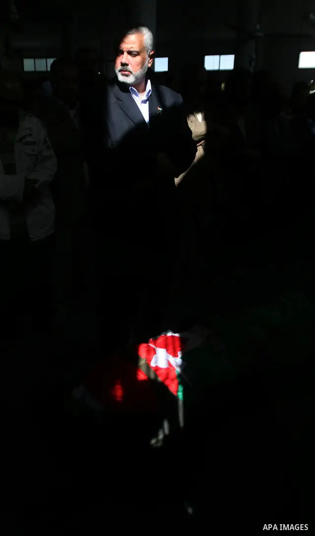 Palestinian prime minister in Gaza Strip, Ismail Haniya attends the funeral of Mohammed Al Kelani, a Hamas security officer, in Beit Lahiya, northern Gaza Strip, Monday, Nov. 14, 2011. Al Kelani was killed in an Israeli...