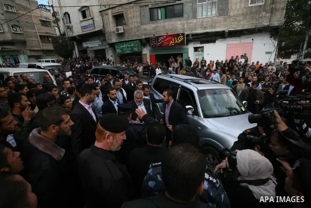 Palestinian prime minister in Gaza Strip, Ismail Haniya attends the funeral of Mohammed Al Kelani, a Hamas security officer, in Beit Lahiya, northern Gaza Strip, Monday, Nov. 14, 2011. Al Kelani was killed in an Israeli...