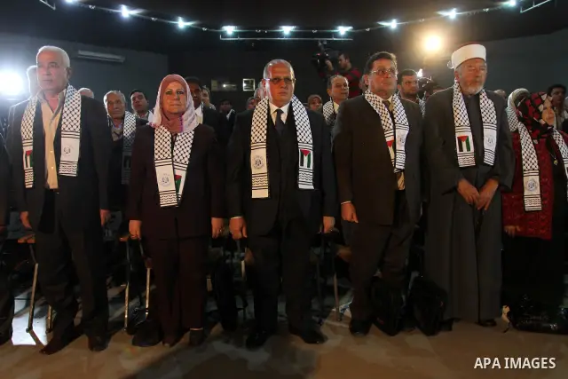 Palestinians participate in a conference about the late president Yasser Arafat which organized by Fatah Movement, in Gaza city on Nov. 15,2011. Photo by Mohammed Asad