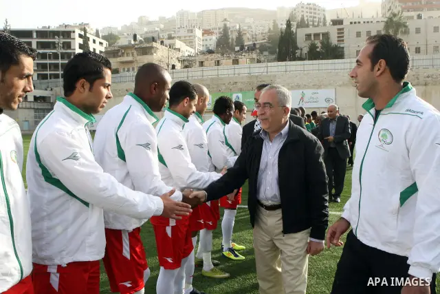 Palestinian Prime Minister, Salam Fayyad attends the match between Palestine national team and South Africa team in the West Bank city of Nablus on Nov. 15, 2011. Photo by Mustafa Abu Dayeh