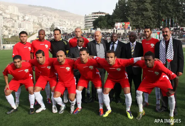 Palestinian Prime Minister, Salam Fayyad attends the football match between Palestine national team and South Africa team in the West Bank city of Nablus on Nov. 15, 2011. Photo by Wagdi Eshtayah