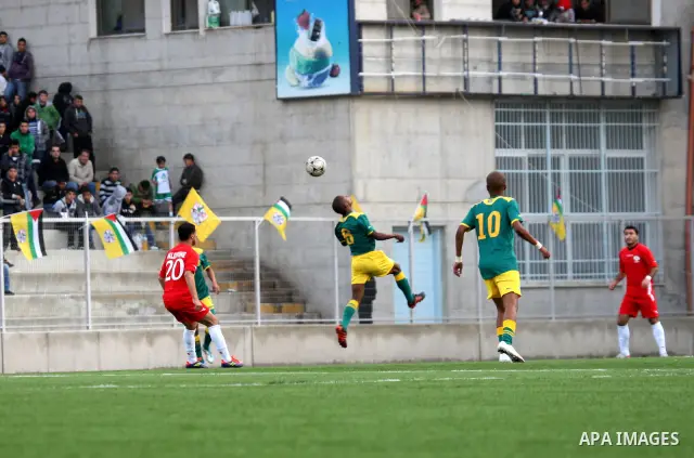 South African (Green) and Palestinian (Red) football players fight for the ball during football match in the West Bank town of Nablus, on Nov. 15, 2011. The match ended in 1-1draw. Photo by Wagdi Eshtayah