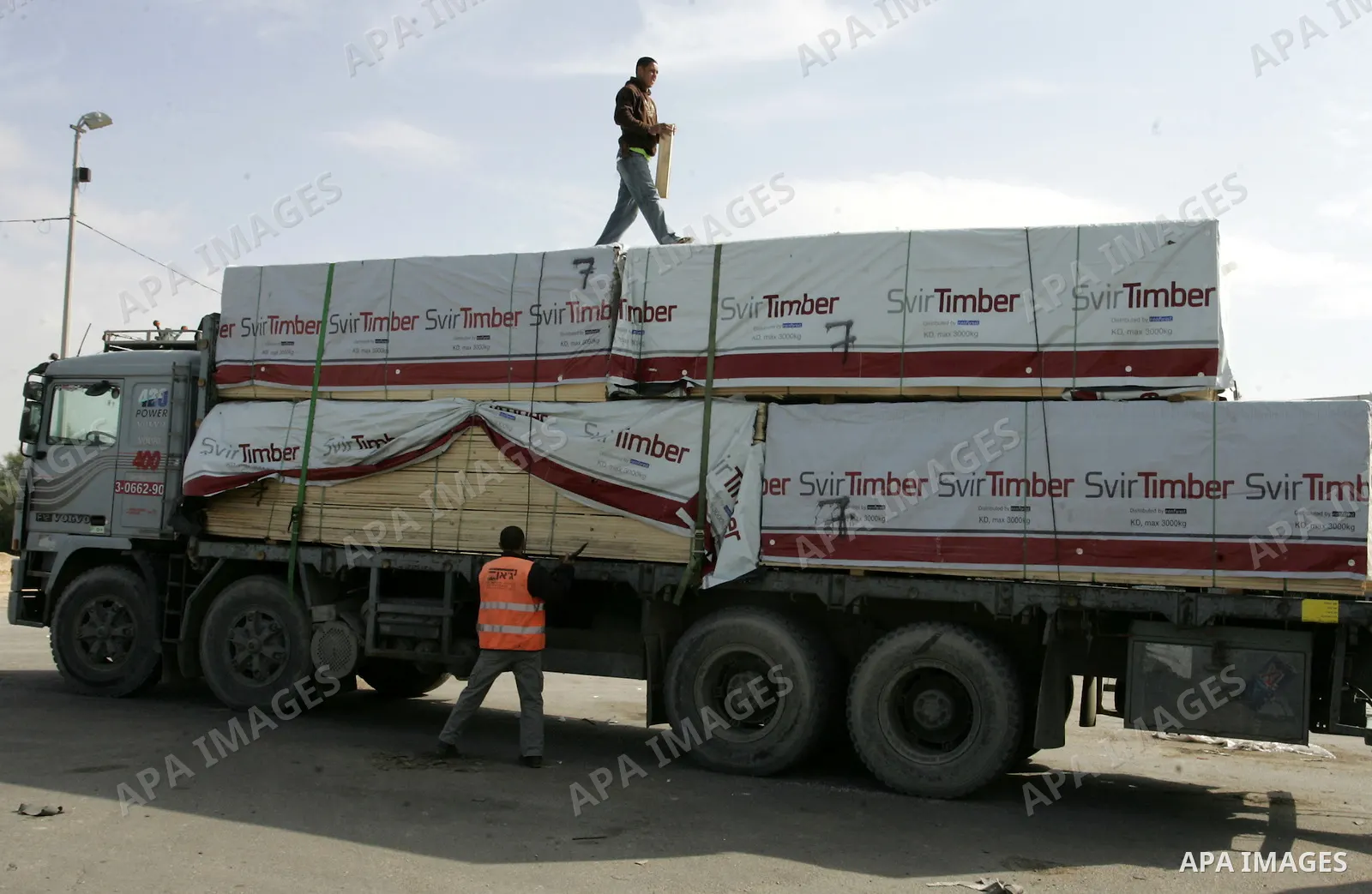 Palestinians check trucks loaded with construction materials at the Rafah crossing which entered through Israel's Kerem Shalom crossing in southern Gaza Strip on November 16, 2011. Israel allowed to enter the constructio...