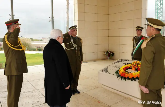 Palestinian leader Mahmud Abbas lays a wreath at the tomb of late leader Yasser Arafat during a celebration on November 16, 2011 in the West Bank city of Ramallah. The celebration was timed to mark seven years since the...