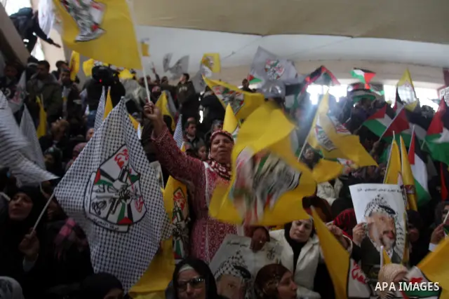 Supporters of the Palestinian President Mahmoud Abbas gather during his speech to the Palestinian leadership on November 16, 2011 in the West Bank city of Ramallah. The address was timed to mark seven years since the dea...
