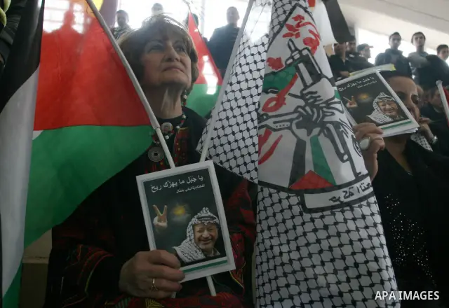 Supporters of the Palestinian President Mahmoud Abbas gather during his speech to the Palestinian leadership on November 16, 2011 in the West Bank city of Ramallah. The address was timed to mark seven years since the dea...