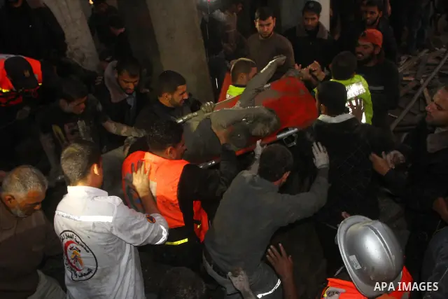 Palestinian rescue teams inspect the scene of a collapsed bridge on a main road in the central Gaza Strip that links Gaza City with the south, near Nusseirat, on November 17, 2011. Medical sources said two Palestinian wo...