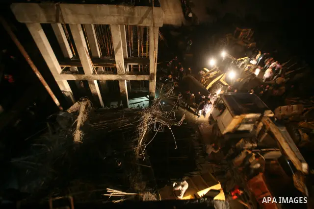 Palestinian rescue teams inspect the scene of a collapsed bridge on a main road in the central Gaza Strip that links Gaza City with the south, near Nusseirat, on November 17, 2011. Medical sources said two Palestinian wo...