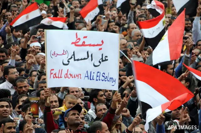 Protesters chant slogans in Tahrir Square, the focal point of the uprising that ousted President Hosni Mubarak, in Cairo, Egypt, Friday, Nov. 18, 2011. Thousands of Egyptians are rallying in Cairo's Tahrir square, with I...