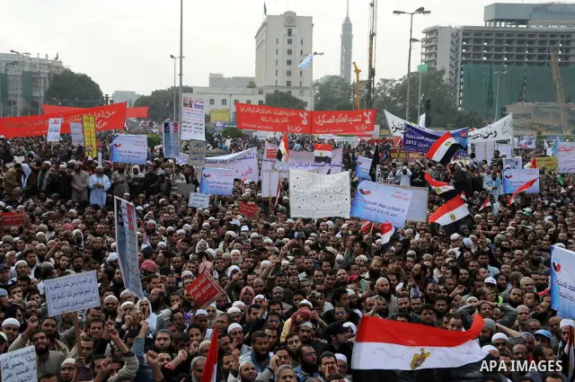 Protesters chant slogans in Tahrir Square, the focal point of the uprising that ousted President Hosni Mubarak, in Cairo, Egypt, Friday, Nov. 18, 2011. Thousands of Egyptians are rallying in Cairo's Tahrir square, with I...