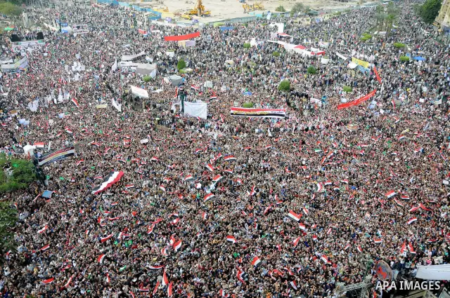 Protesters gather at Tahrir Square, the focal point of the uprising that ousted President Hosni Mubarak, in Cairo, Egypt, Friday, Nov. 18, 2011. Thousands of Egyptians are rallying in Cairo's Tahrir square, with Islamist...
