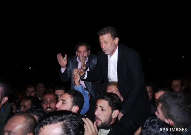 Palestinian freed prisoner Nael Barghouti and his bride Amal Nafea are greeted by relatives and friends during their wedding, in the West Bank city of Ramallah on Nov. 18,2011. Nael Barghouti released from the Israeli ja...