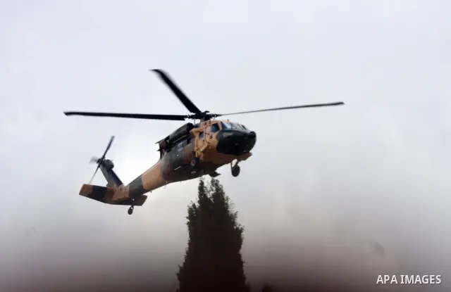 A Jordanian helicopter flies as Palestinian President Mahmoud Abbas and King Abdullah of Jordan meet in the West Bank city of Ramallah November 21, 2011. Abdullah arrived in Ramallah on Monday for a rare visit to the Isr...