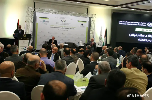 Palestinian Prime Minister Salam Fayyad participate in the opening ceremony of the fifth annual of the Palestinian capital market forum, in the West Bank city of Ramallah November 21, 2011. Photo by Issam Rimawi