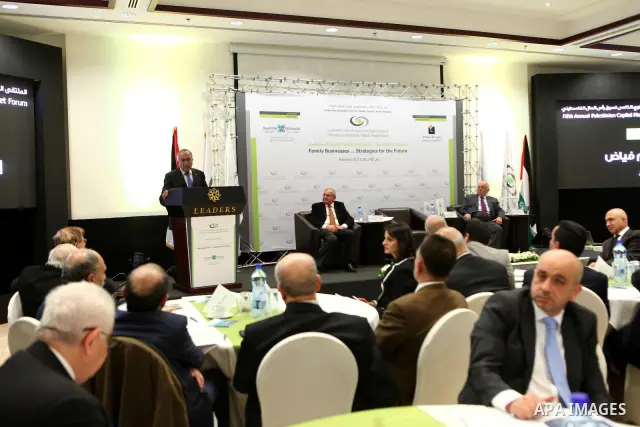 Palestinian Prime Minister Salam Fayyad participate in the opening ceremony of the fifth annual of the Palestinian capital market forum, in the West Bank city of Ramallah November 21, 2011. Photo by Mustafa Abu Dayeh