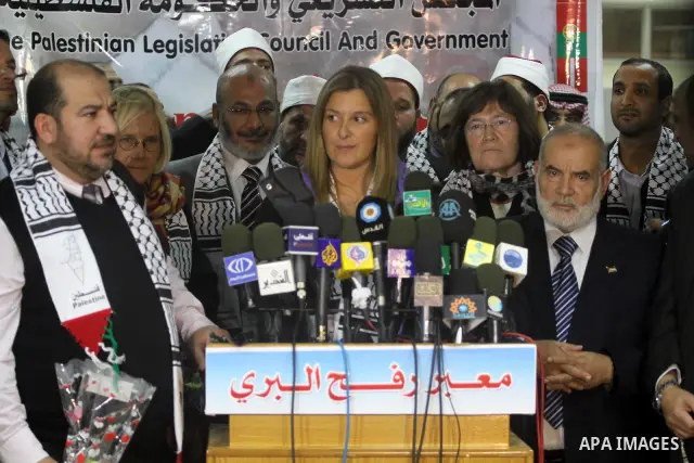 Palestinians take part in a press conference to receive the international delegation, which includes European parliamentarians and international and solidarities Arab to break the siege on Gaza, in Gaza city on Nov. 21,...