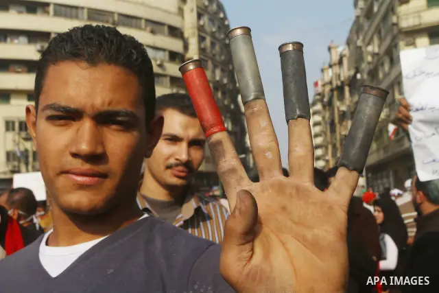 Egyptian protesters clash with riot police in a Cairo street on November 22, 2011. Thousands of protesters swarmed Cairo's Tahrir Square to demand an end to military rule, heightening tension after days of deadly clashes...