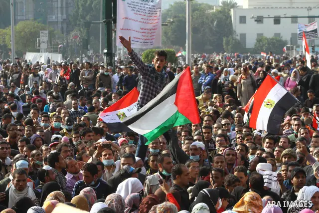 Thousands of Egyptian protesters attend a rally in Tahrir Square on the fourth day of clashes between protesters and riot police in the capital Cairo, on November 22, 2011, as they demand an end to military rule, heighte...